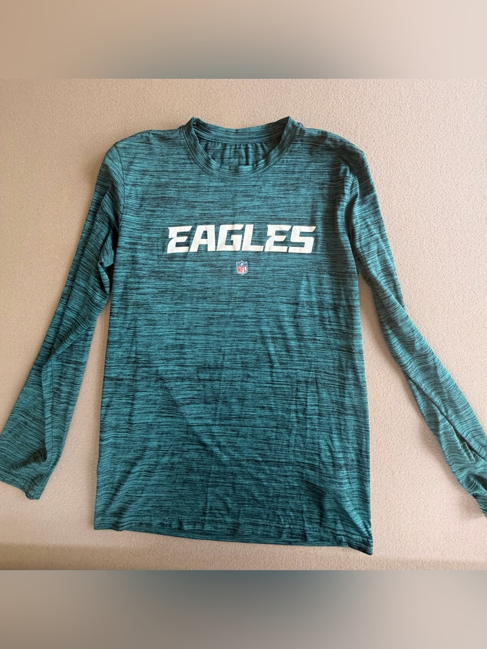 Nike Dri Fit Eagles Long Sleeve Team Tee in Green with graphics on sleeves
